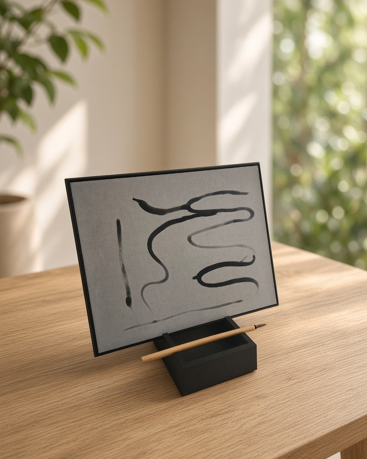 The board in landscape on an oak table by a window, covered in water brushstrokes